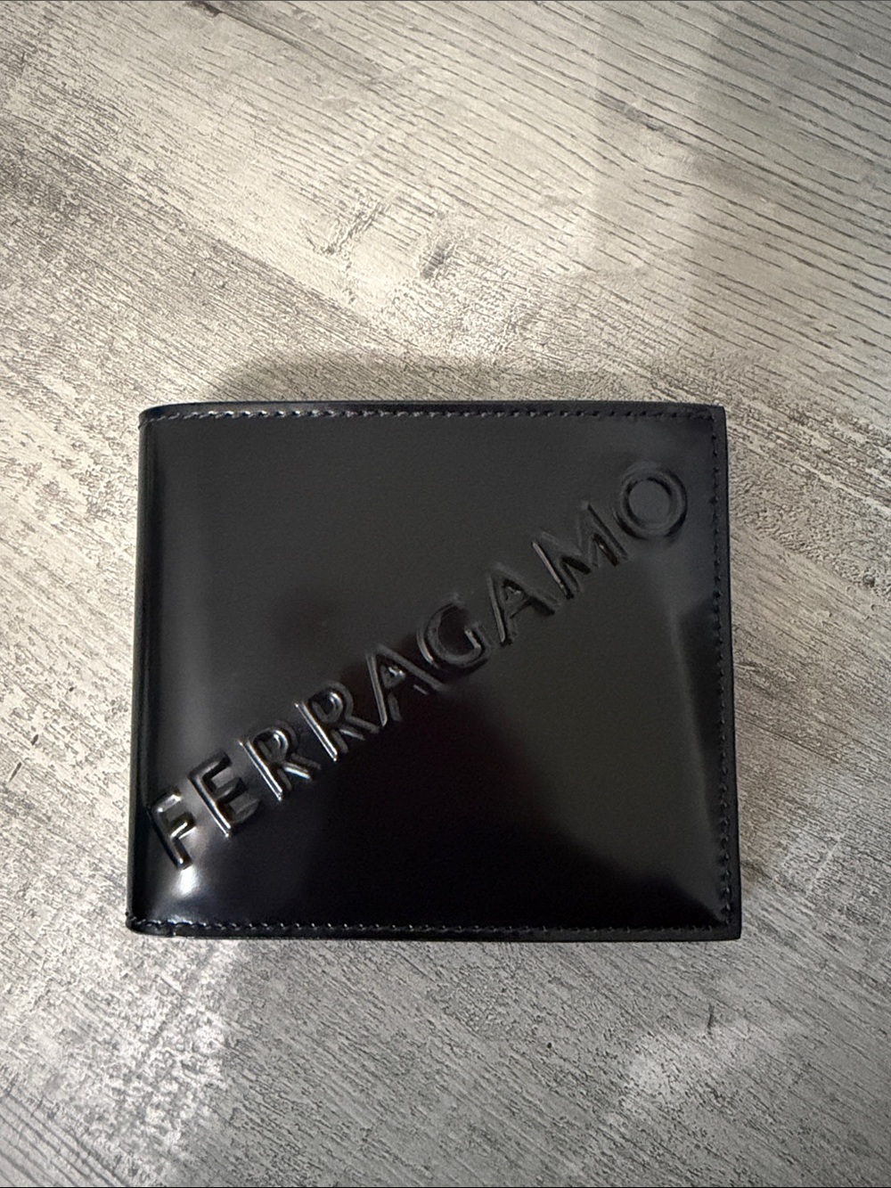 Salvatore Ferragamo Black Gloss Leather Wallet with Embossed Logo